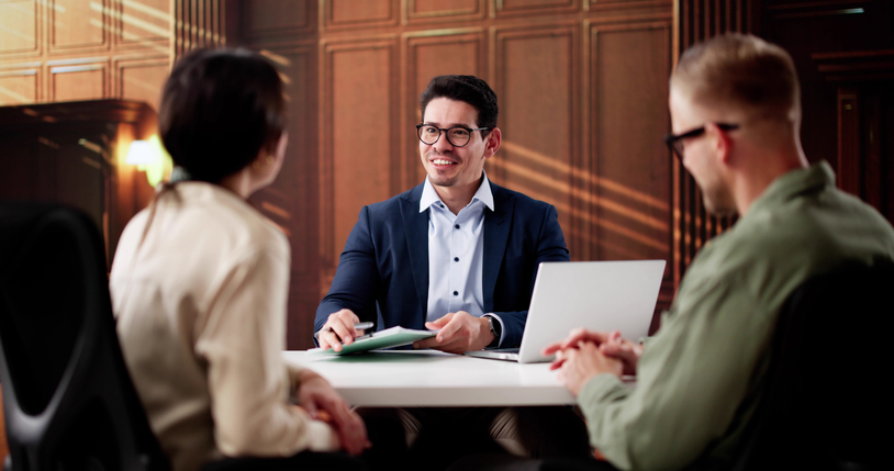 Family Lawyer Consults With Divorcing Couple In Court Proceedings.